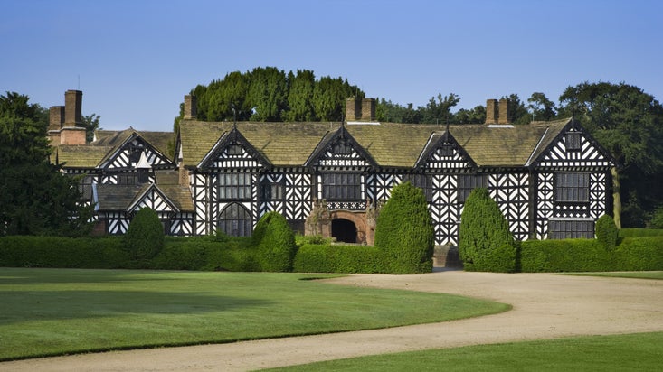 The timber-frame exterior of Speke Hall, Liverpool on a sunny day